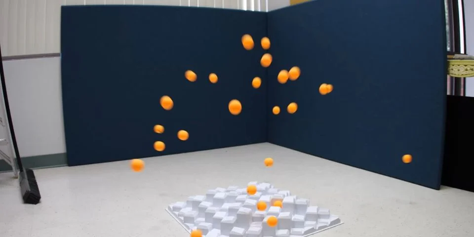 Model C diffusion demonstration with orange ping pong balls showing scattering