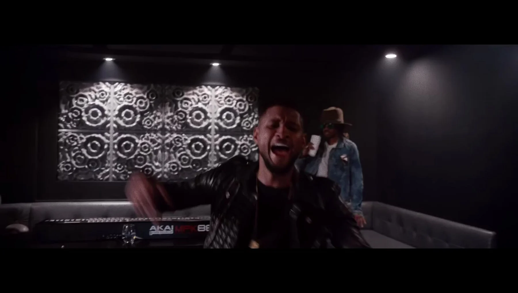 Frame from Usher's Rivals video showing Model D diffusers in a studio